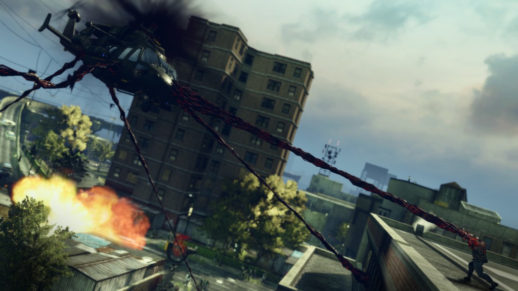 A tendril attack reaches toward a helicopter above the city.