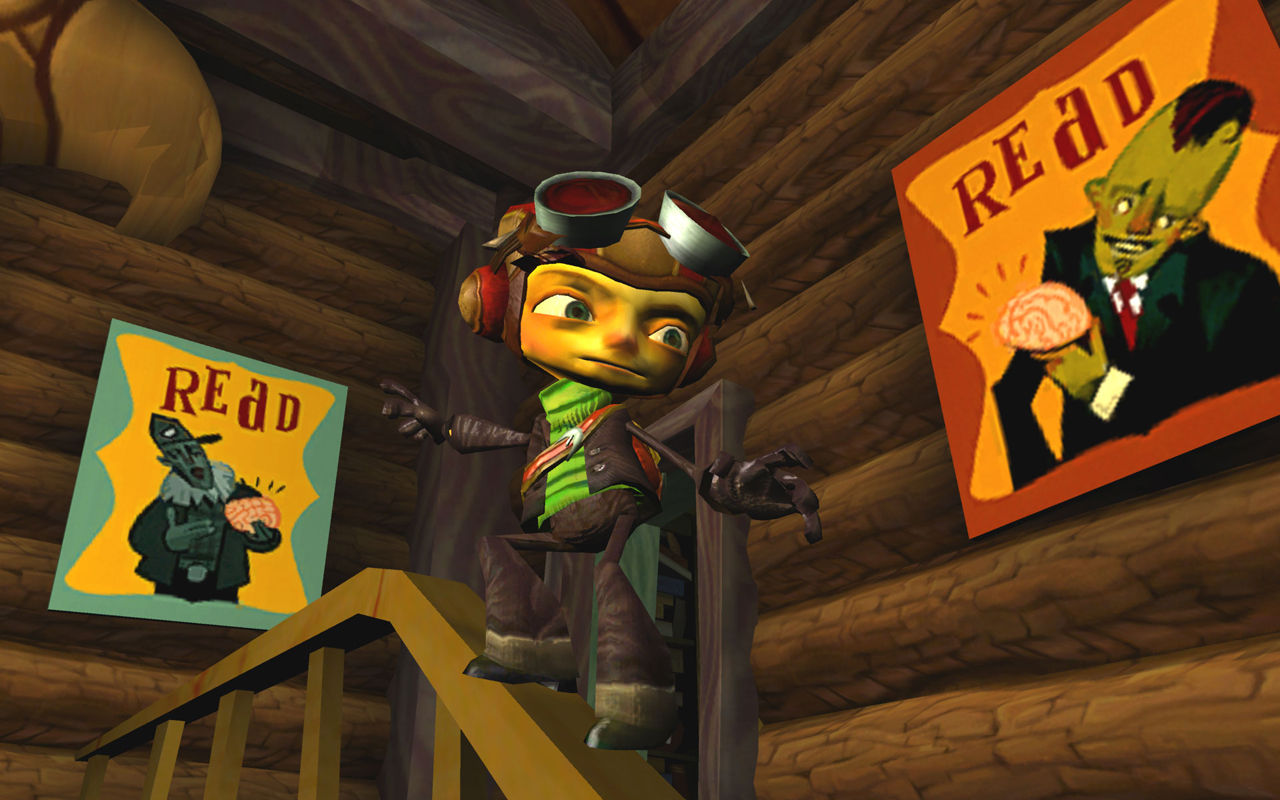 Raz stands inside a wooden structure lined with posters.