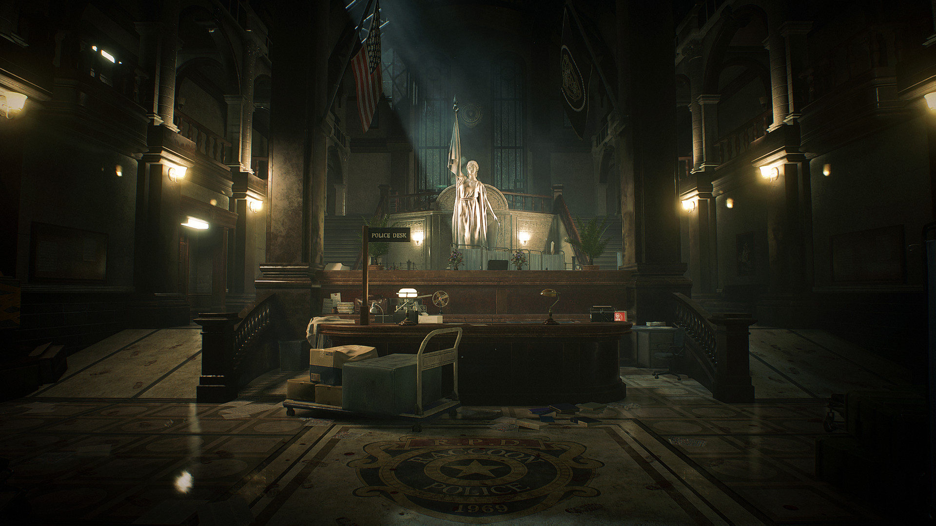 The police station’s main hall is lit beneath a statue.
