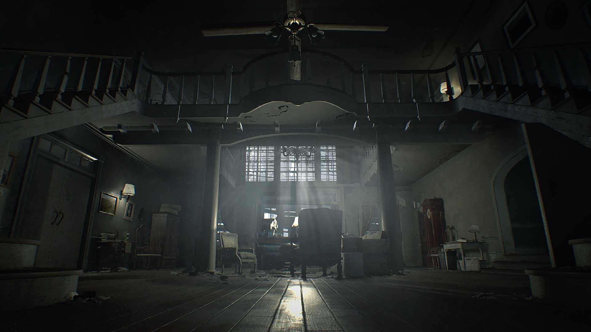 A dim room in the Baker house opens beneath a ceiling fan.