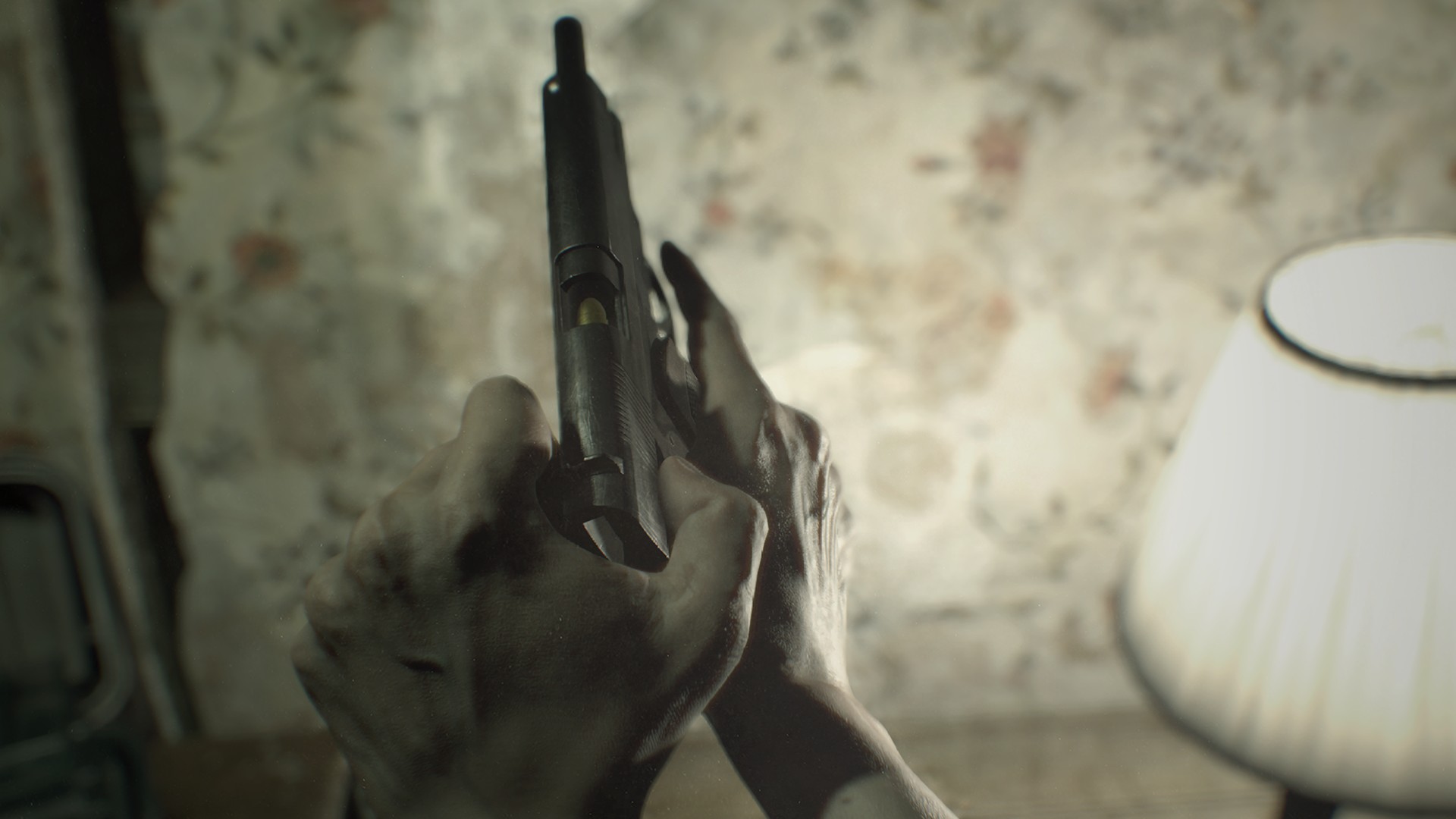 Ethan handles a handgun inside a worn interior.
