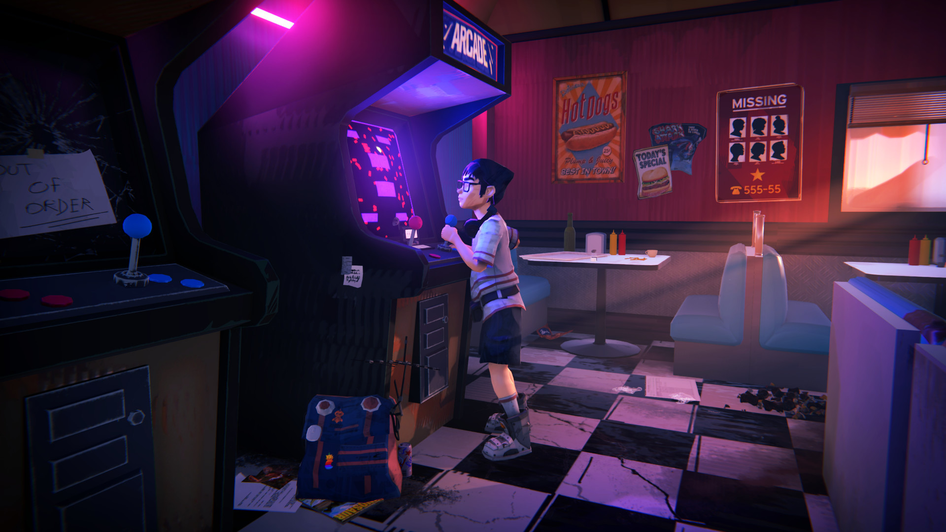 A traveller uses an arcade cabinet in a roadside diner.