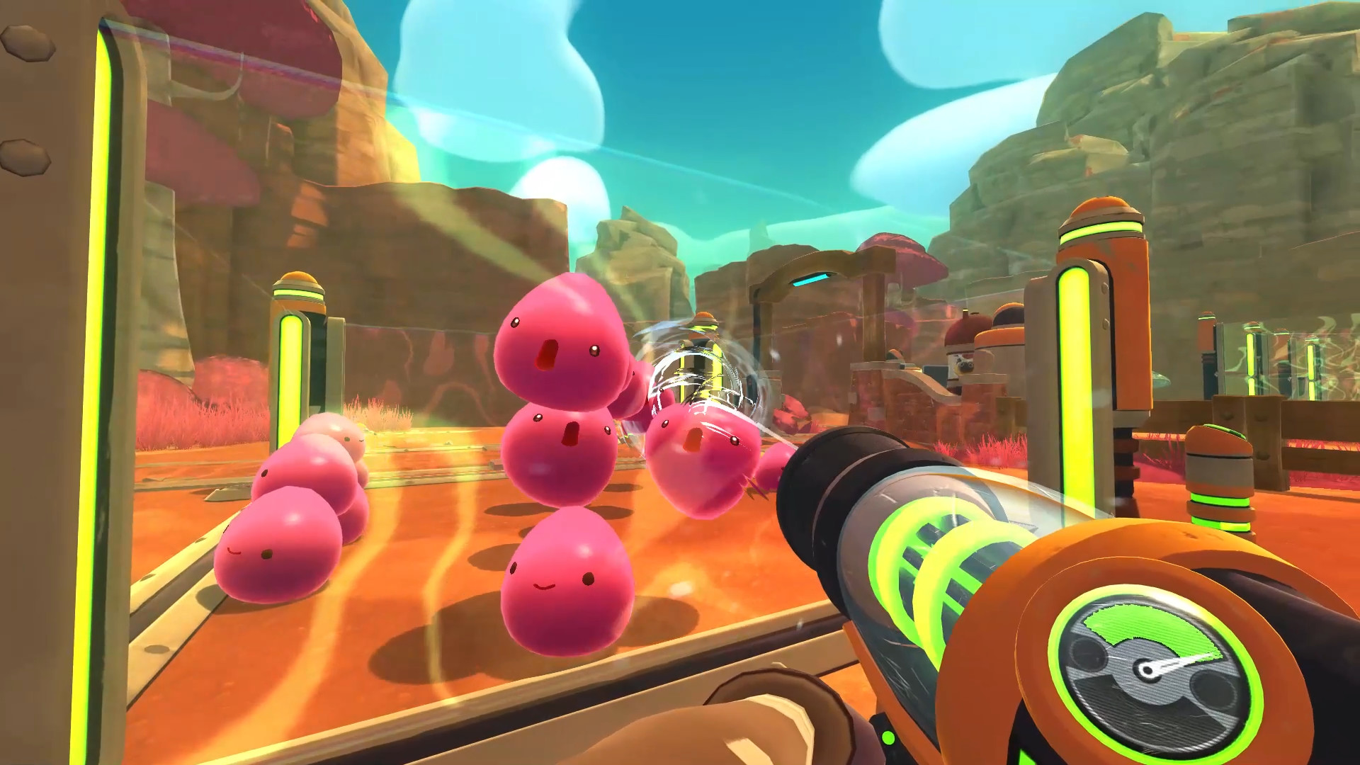 Pink slimes gather inside a ranch corral before the Vacpack.