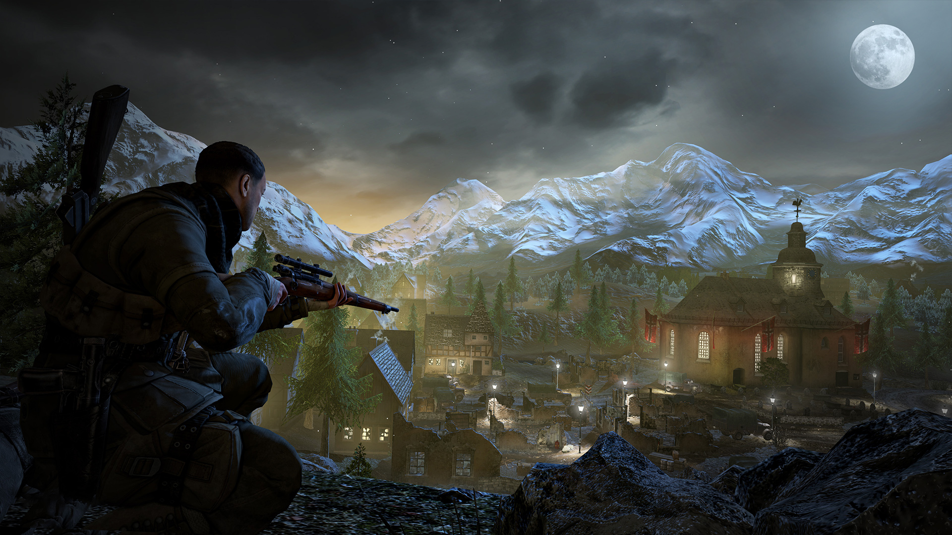 Karl watches a moonlit town from a rocky ridge.