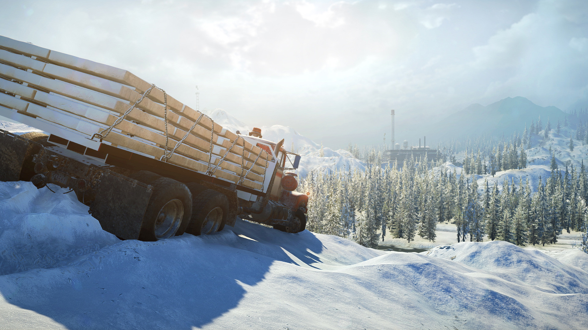 A cargo truck hauls a load through deep snow.