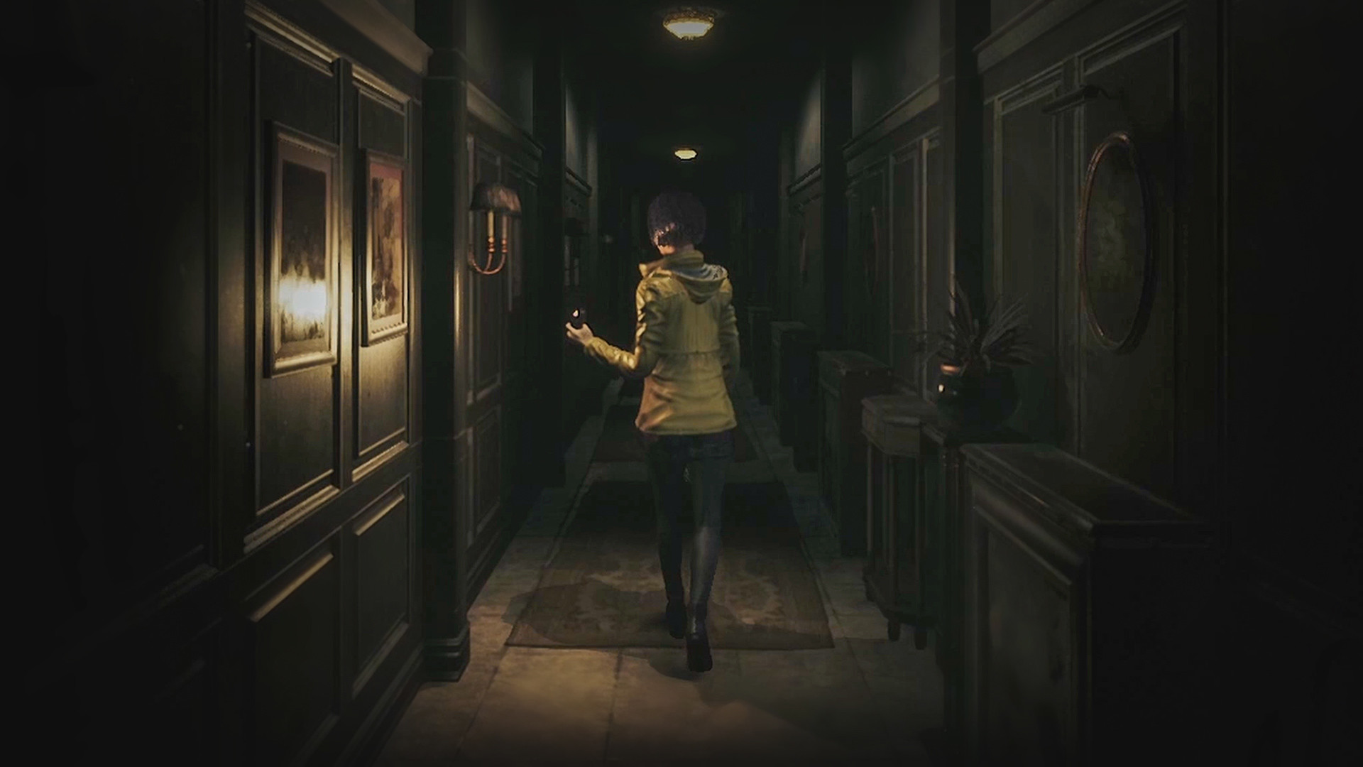 A character walks down a dim hallway carrying a light.