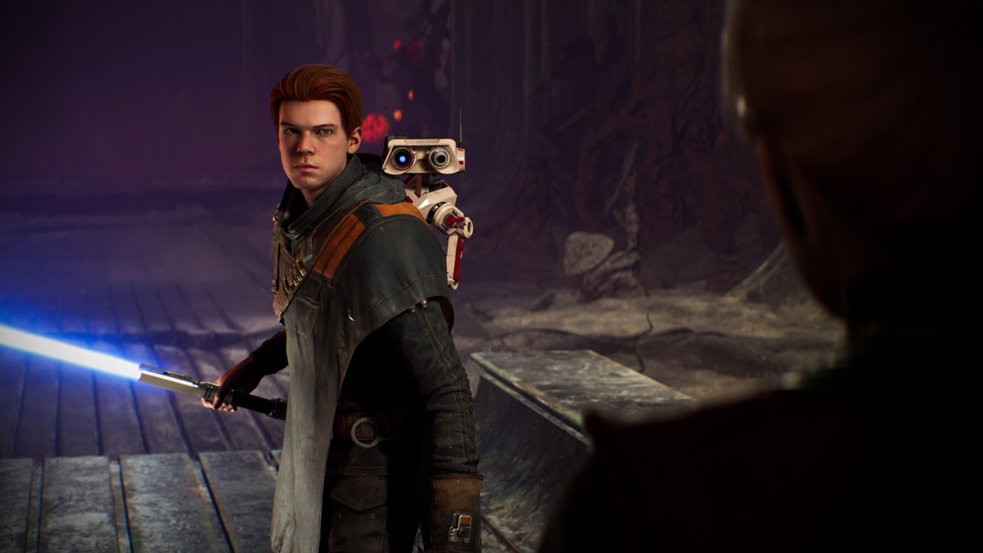 Cal Kestis holds a lightsaber with BD-1 on his shoulder.