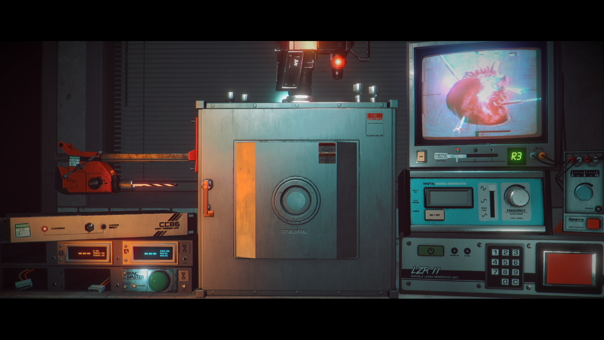 A laboratory workstation holds electronic instruments and a monitor.