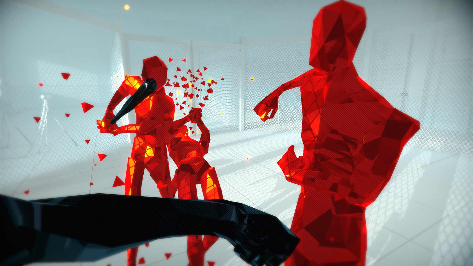 Several red enemies close in during a first-person fight.