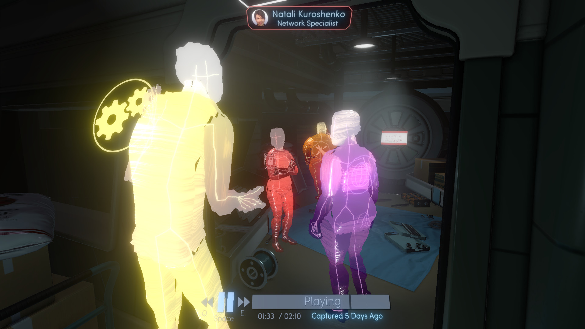 Holographic recordings show crew members speaking in a station room.
