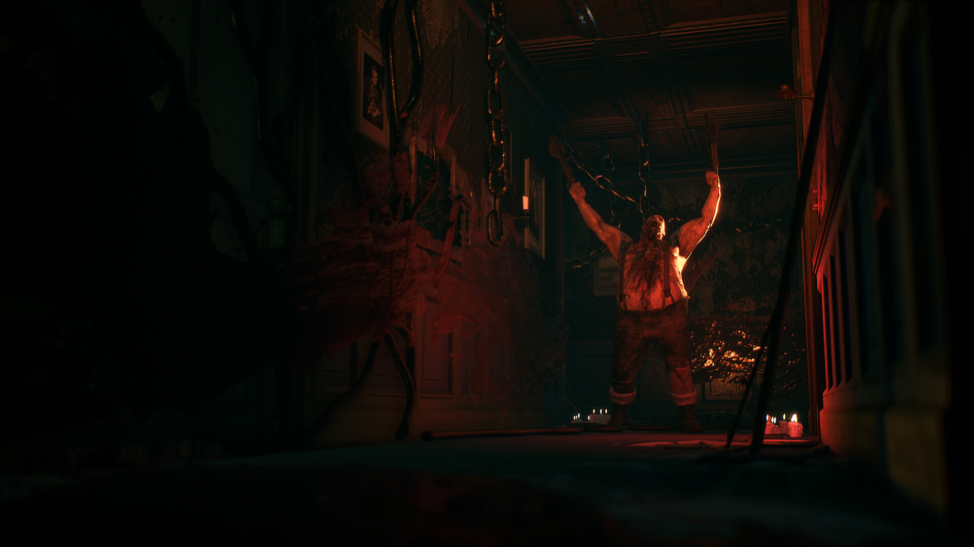 A person appears at the far end of a red-lit corridor.