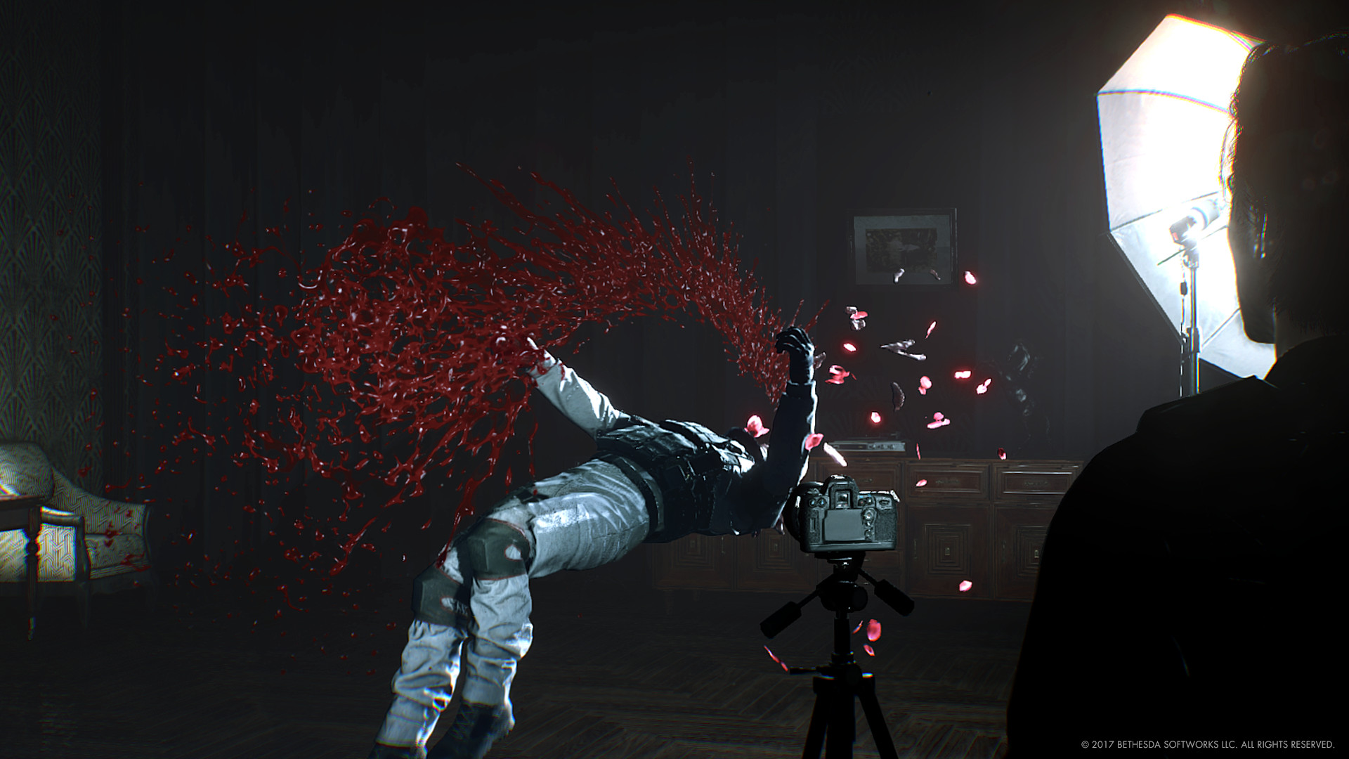 Sebastian watches a figure caught in a violent red burst.