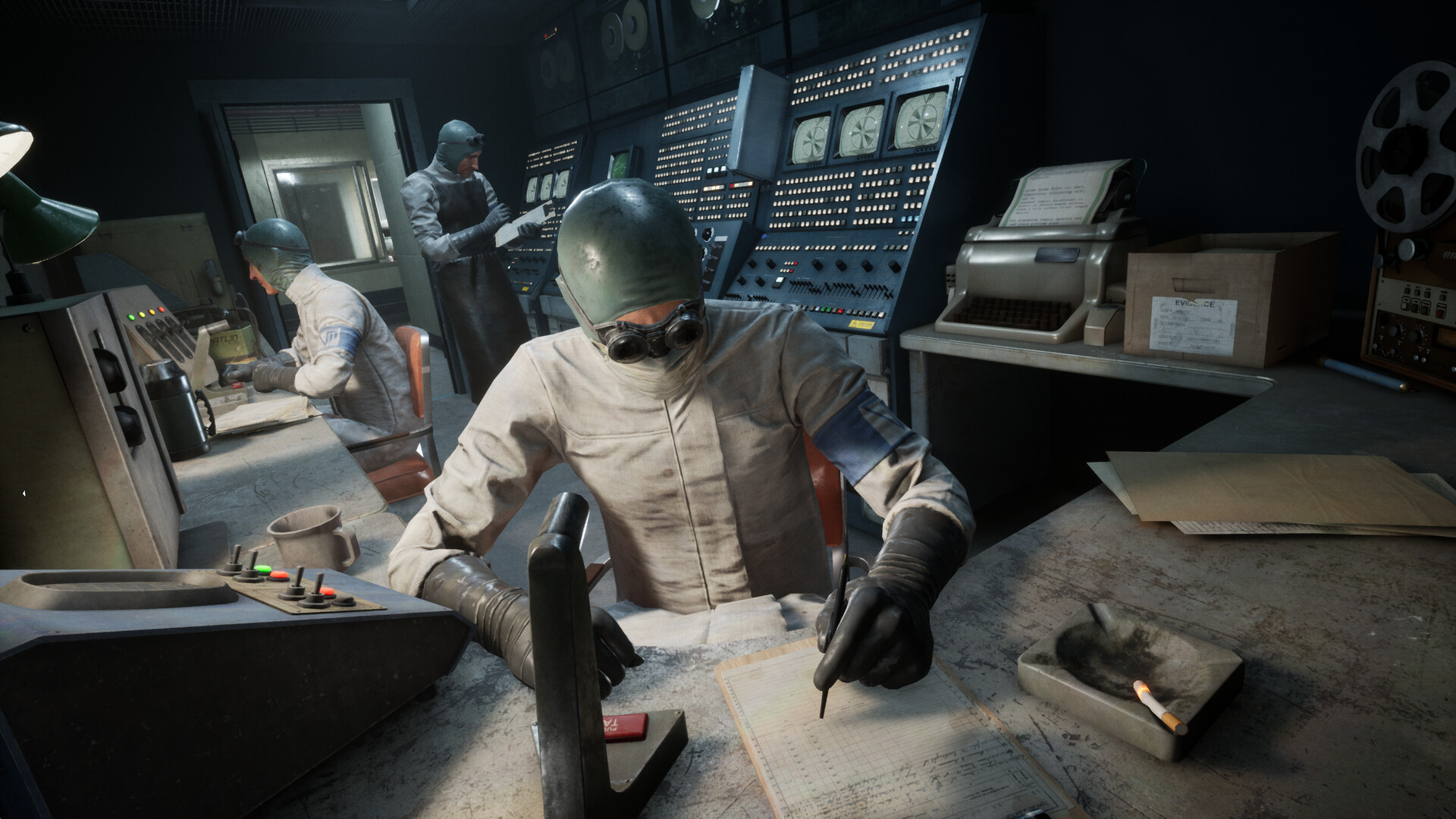 A masked figure looms across a control-room table.