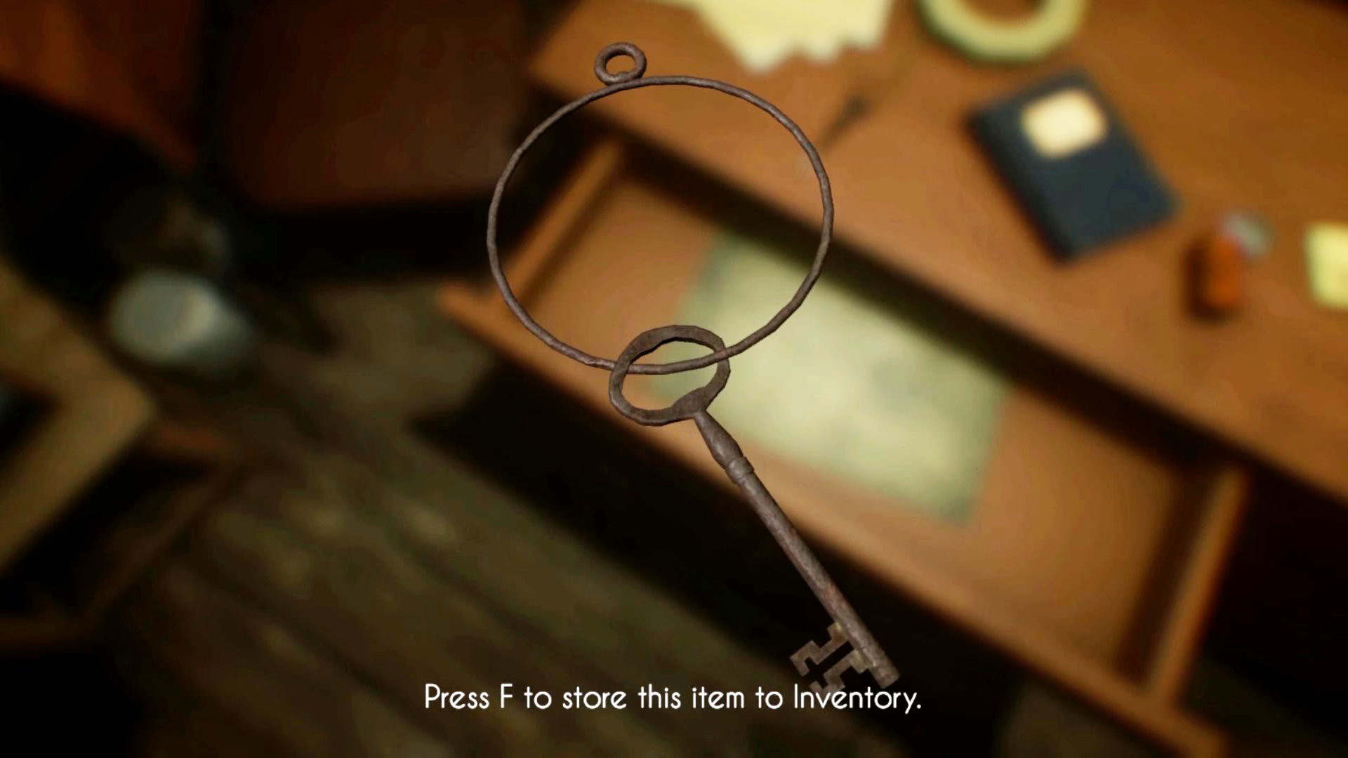 A key hangs above a desk beside investigative items.
