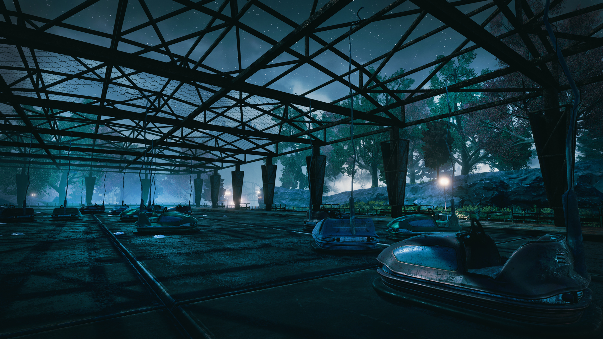 An abandoned ride rests beneath an open metal canopy.
