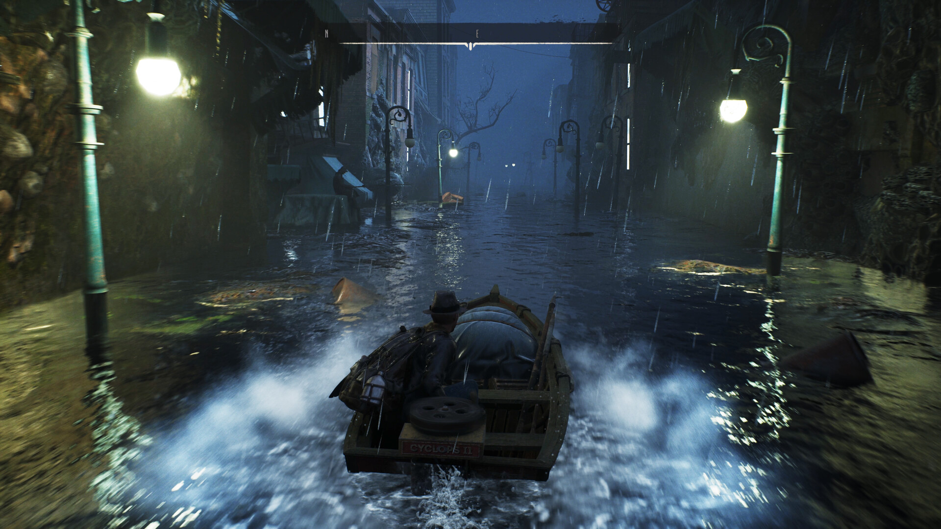 A motorboat travels along a flooded street at night.