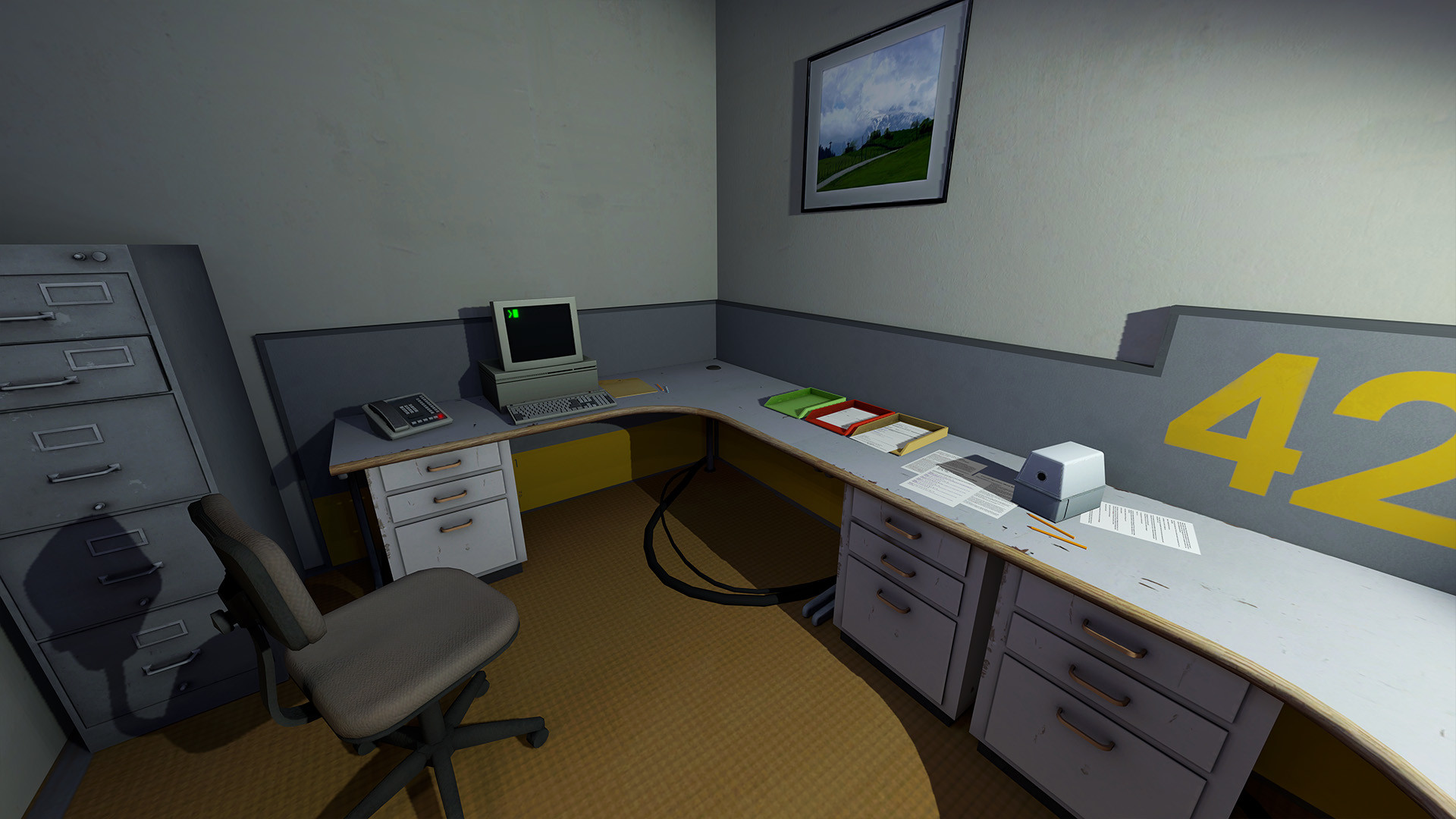Stanley’s empty office desk and computer sit beside the number 427.