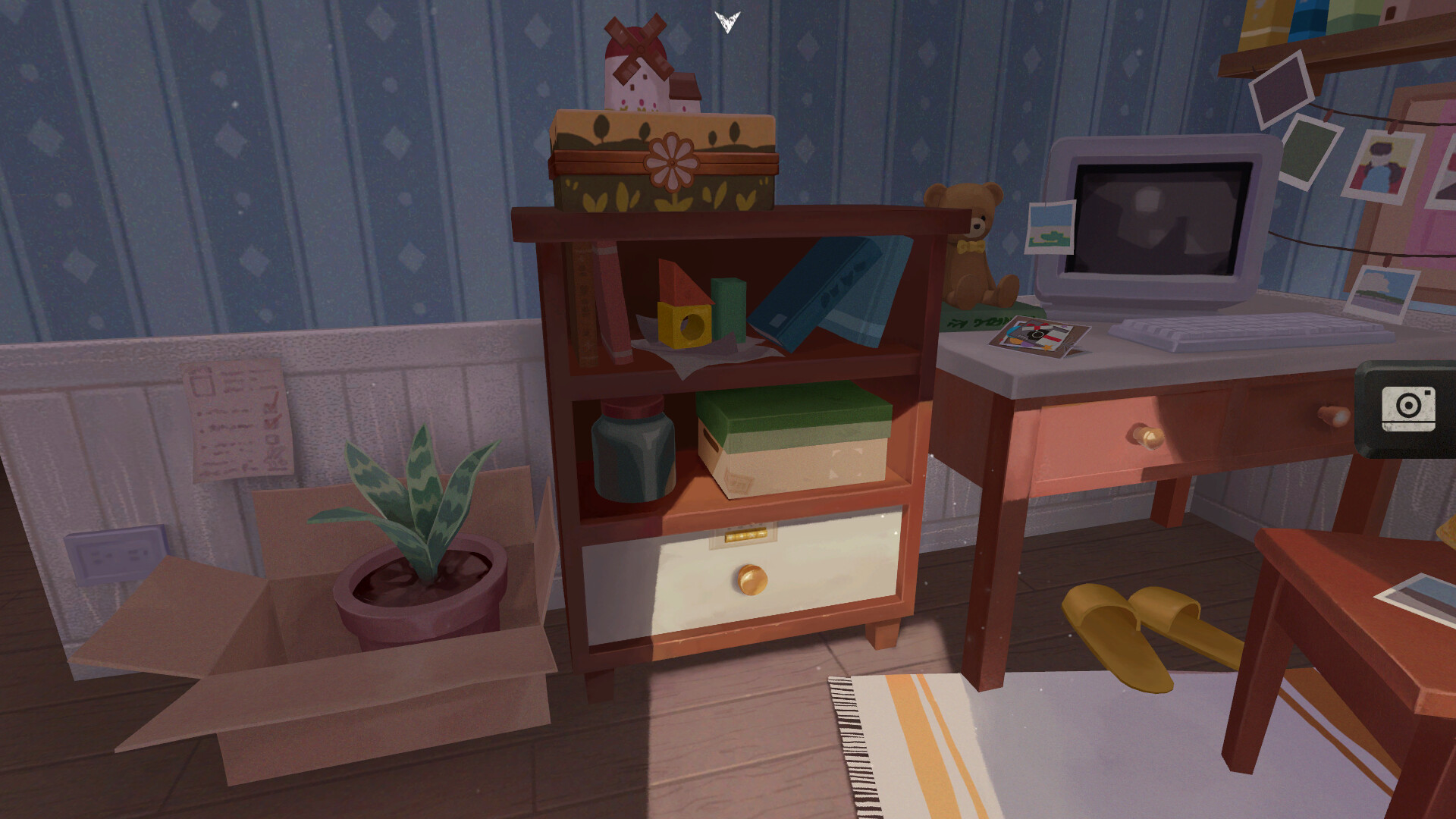 A room contains objects and photographs to examine.
