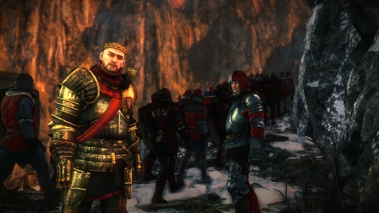 Armoured soldiers gather near a rocky passage.