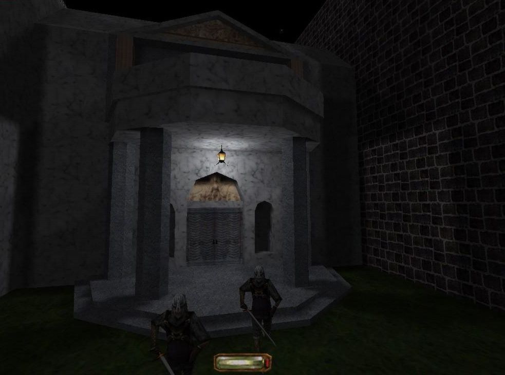 Two guards stand near a stone doorway at night.