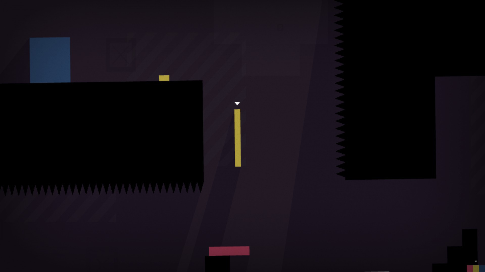 A tall rectangular character waits beside a wall of spikes.