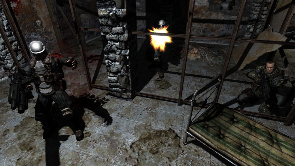 Armoured soldiers exchange fire on an industrial stairwell.