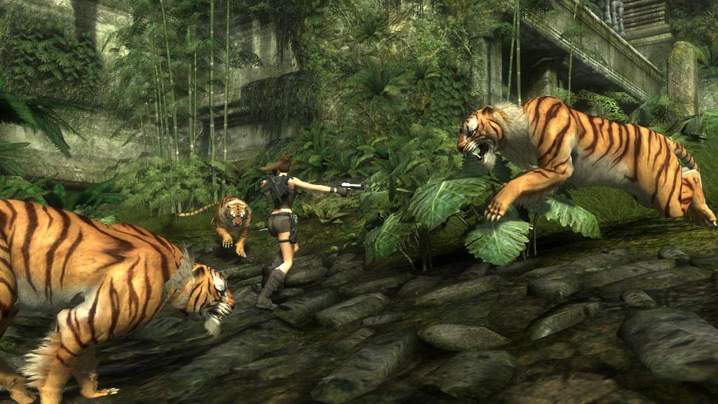 Lara faces tigers in a jungle ruin.