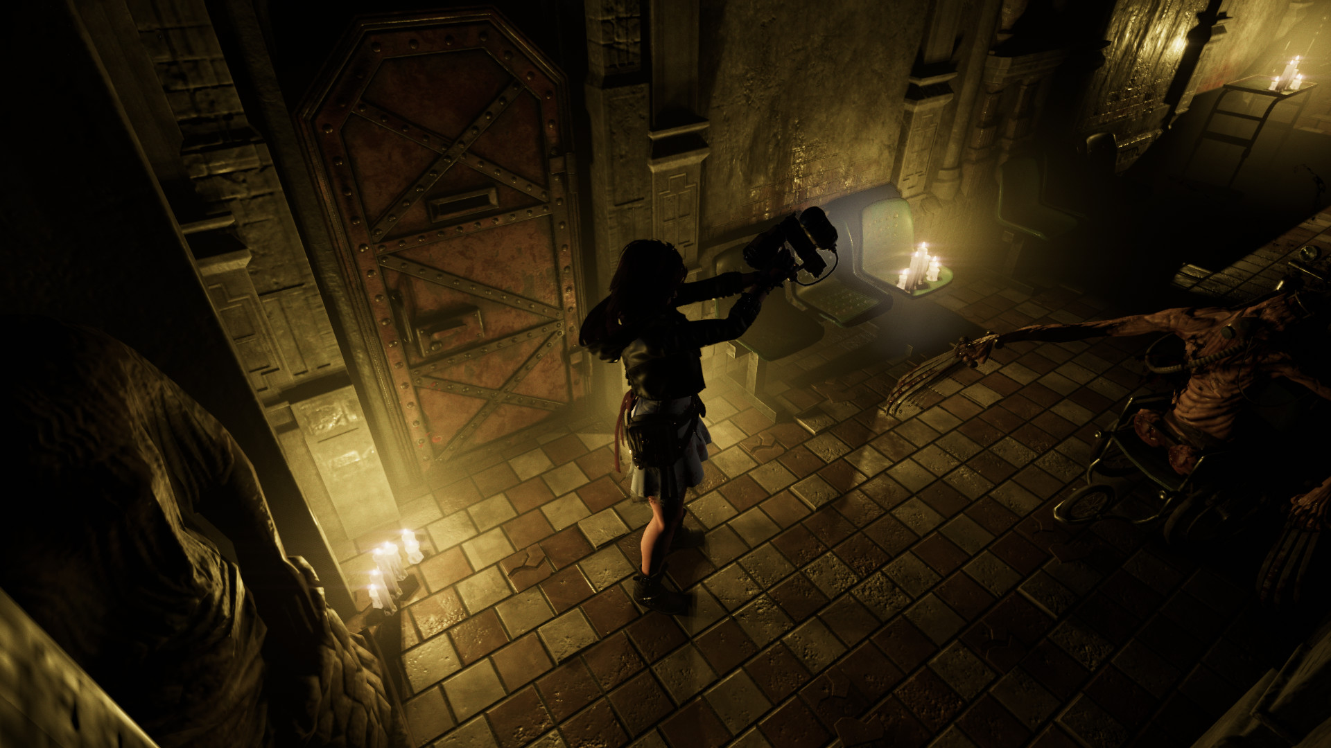 Caroline moves through a dimly lit stairwell.