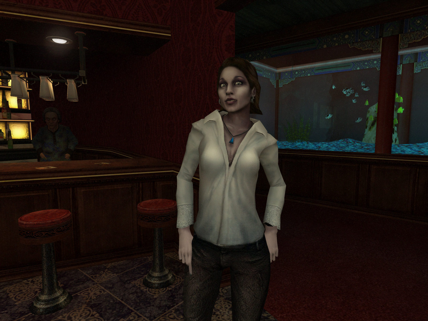A woman stands inside a dimly lit bar.