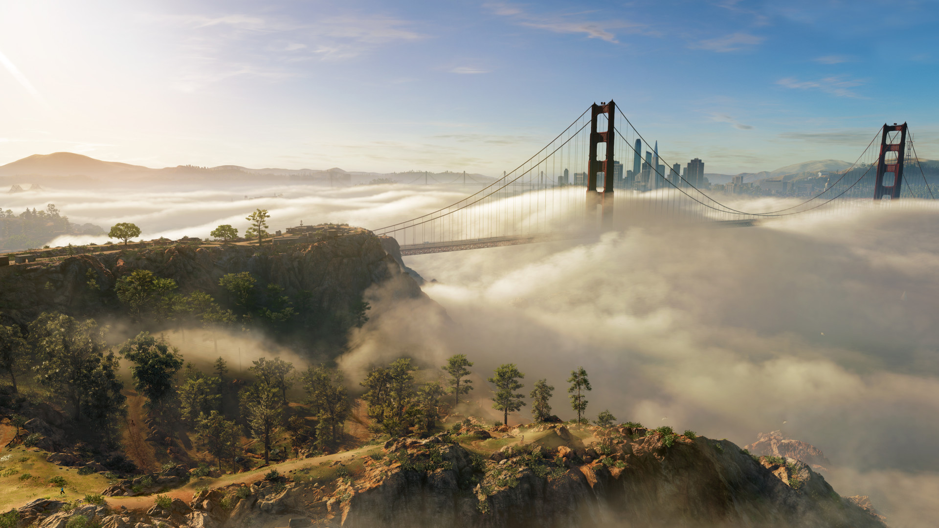 The Golden Gate Bridge rises above low clouds near San Francisco.