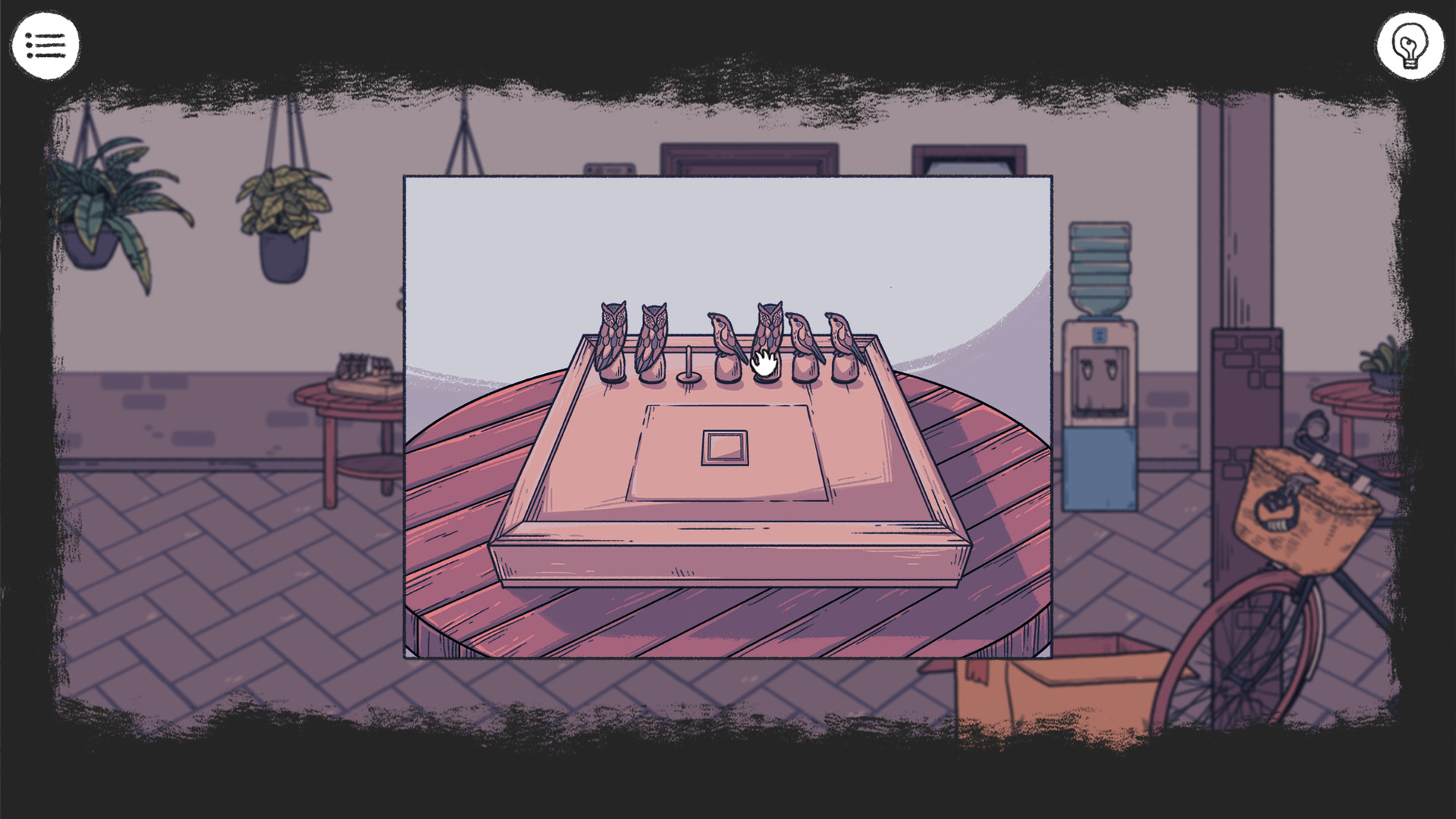 A spiral notebook sits amid the room’s object-based puzzle.