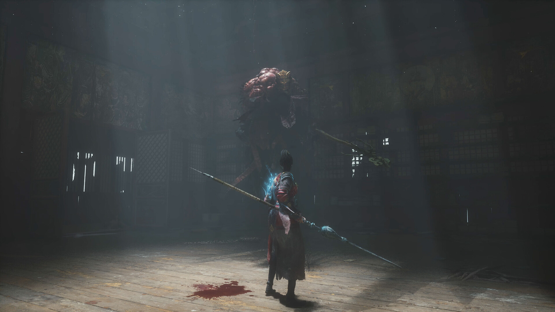 Wuchang holds a polearm before a large creature inside a dark hall.