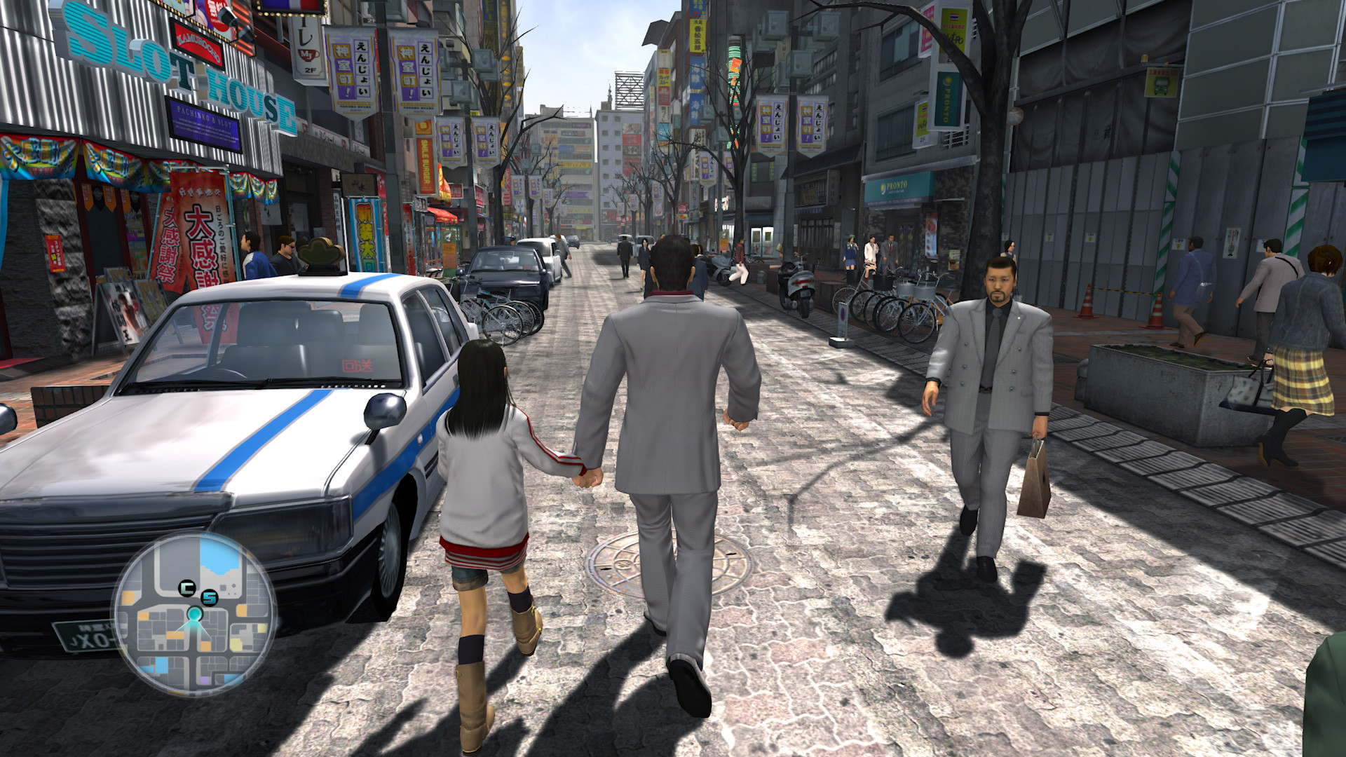 Kiryu and Haruka walk together through a city street.