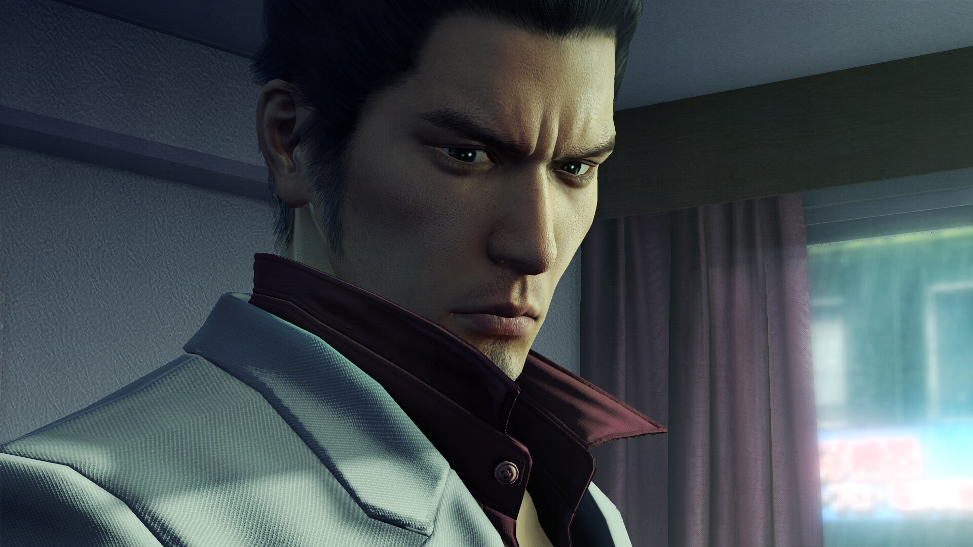 Kazuma Kiryu looks toward someone outside the frame.